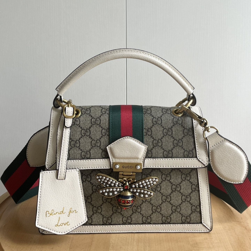 G*u*i top handle bags